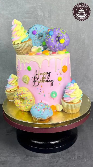 Colorful Donut Drip First Birthday Cake With Cupcake Toppers
