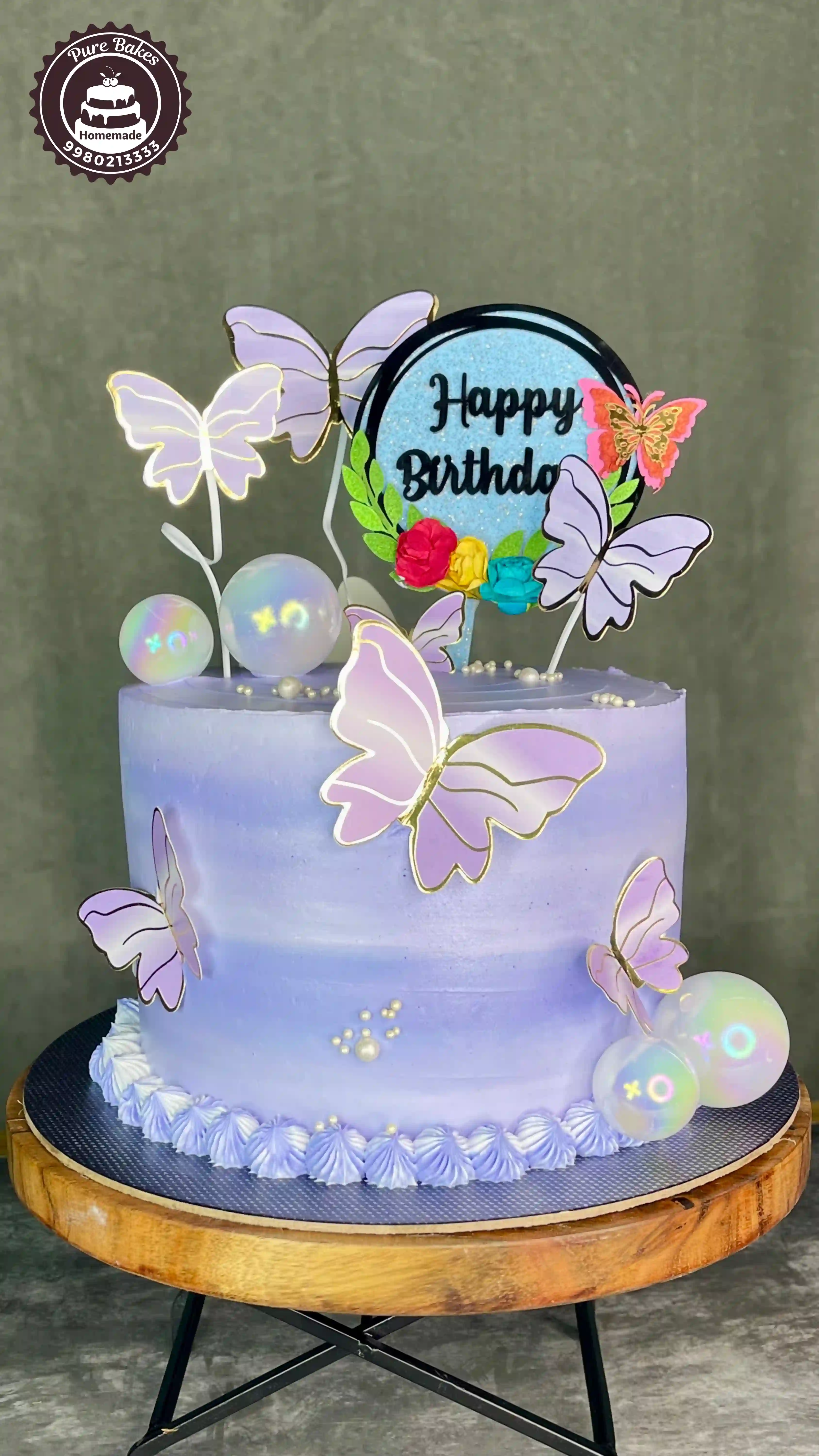 Pastel purple butterfly birthday cake created by PureBakes
