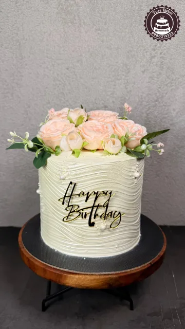 Elegant White Floral Birthday Cake with Peach Roses Design