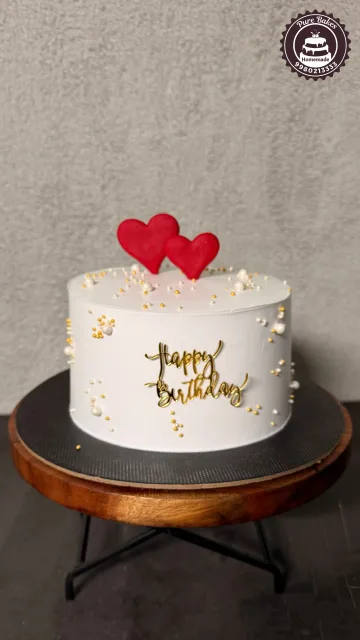 Elegant White Heart Birthday Cake with Gold Pearl Decorations