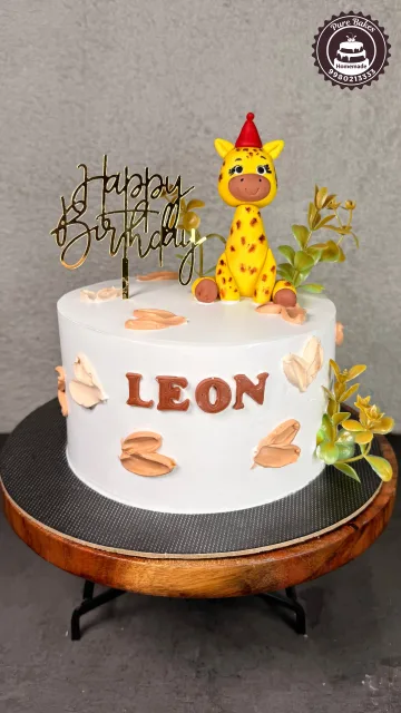 Handcrafted Giraffe Fondant Cake for Baby Birthday Celebration