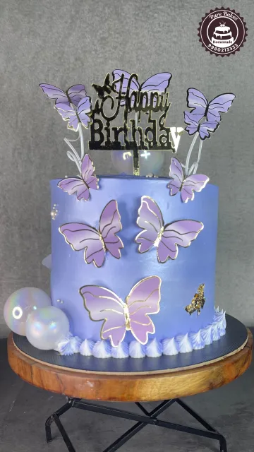 Lavender Birthday Cake with Butterfly Decorations and Pearl Accents