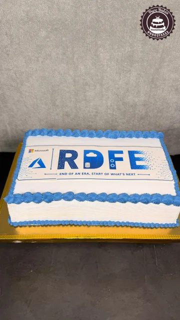 Blue and white rectangular corporate retirement cake featuring Microsoft Azure themed artwork and retirement messaging