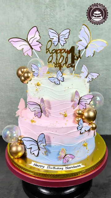 Pastel Butterfly First Birthday Cake with Gold Balloon Decor