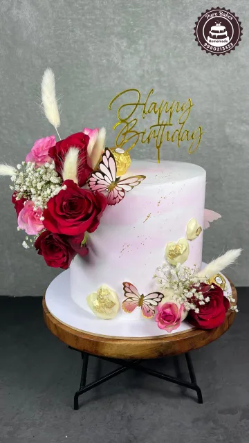 Pink Birthday Cake with Roses Butterflies and Gold Topper
