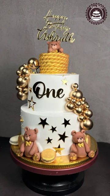 Teddy Bear First Birthday Cake With Gold Balloon Decorations