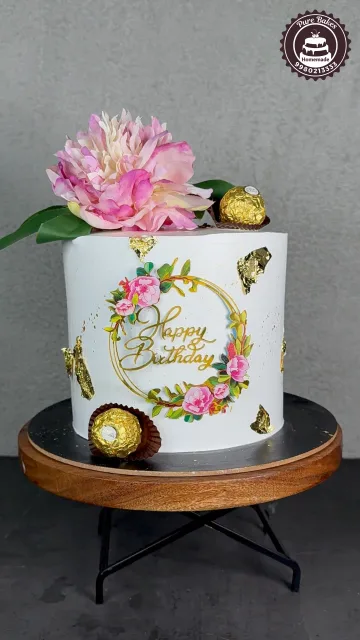 White Birthday Cake with Gold Accents and Peony Decor