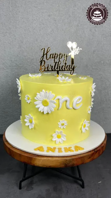 Yellow Daisy First Birthday Cake for Baby Girl Celebration