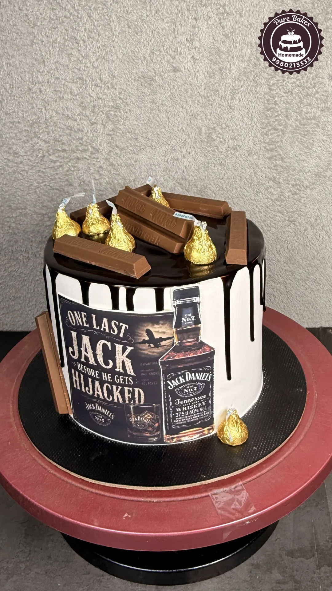 Jack Daniels Drip Cake with KitKat and Hersheys Toppings