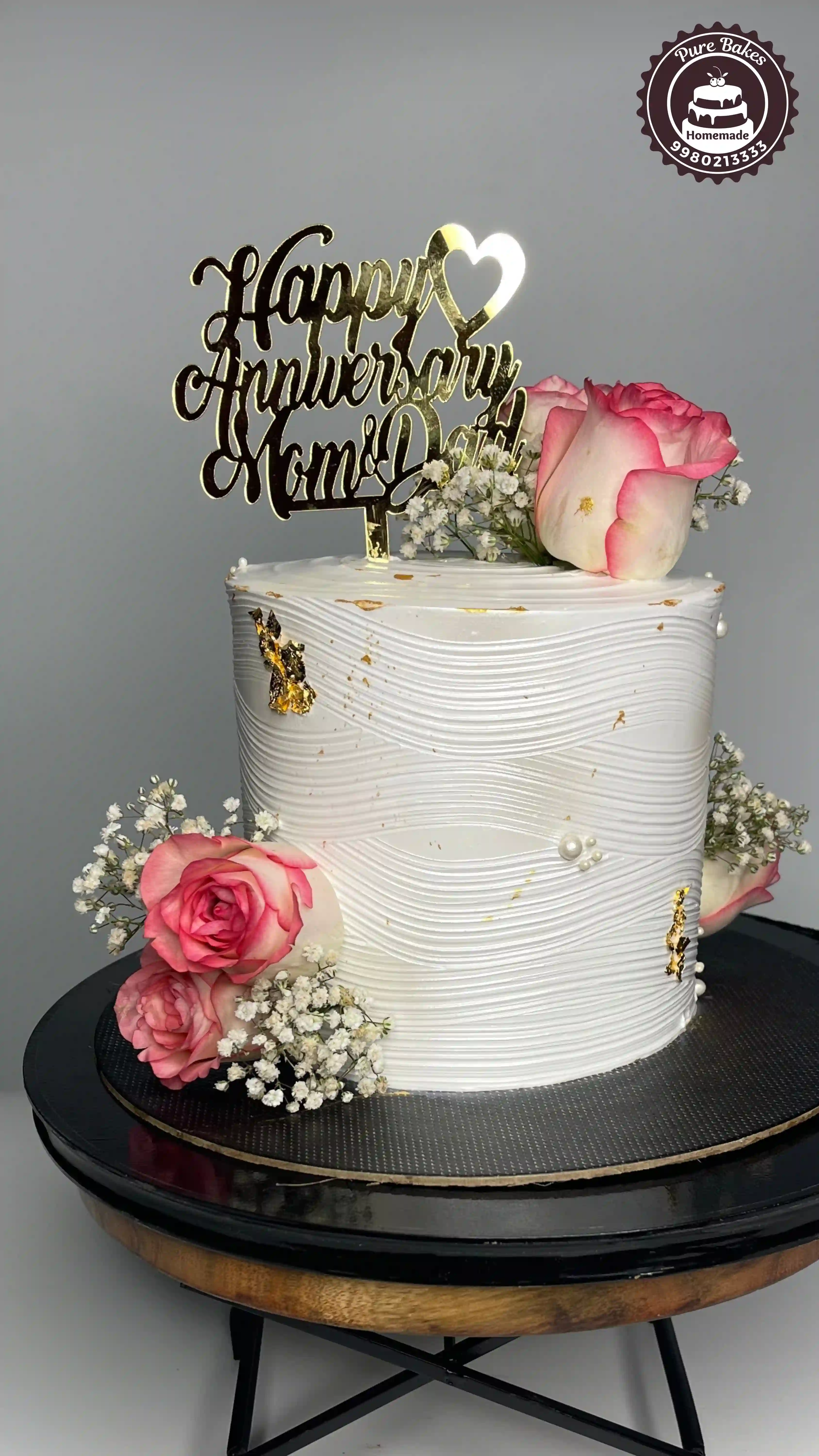 White Floral Anniversary Cake Design