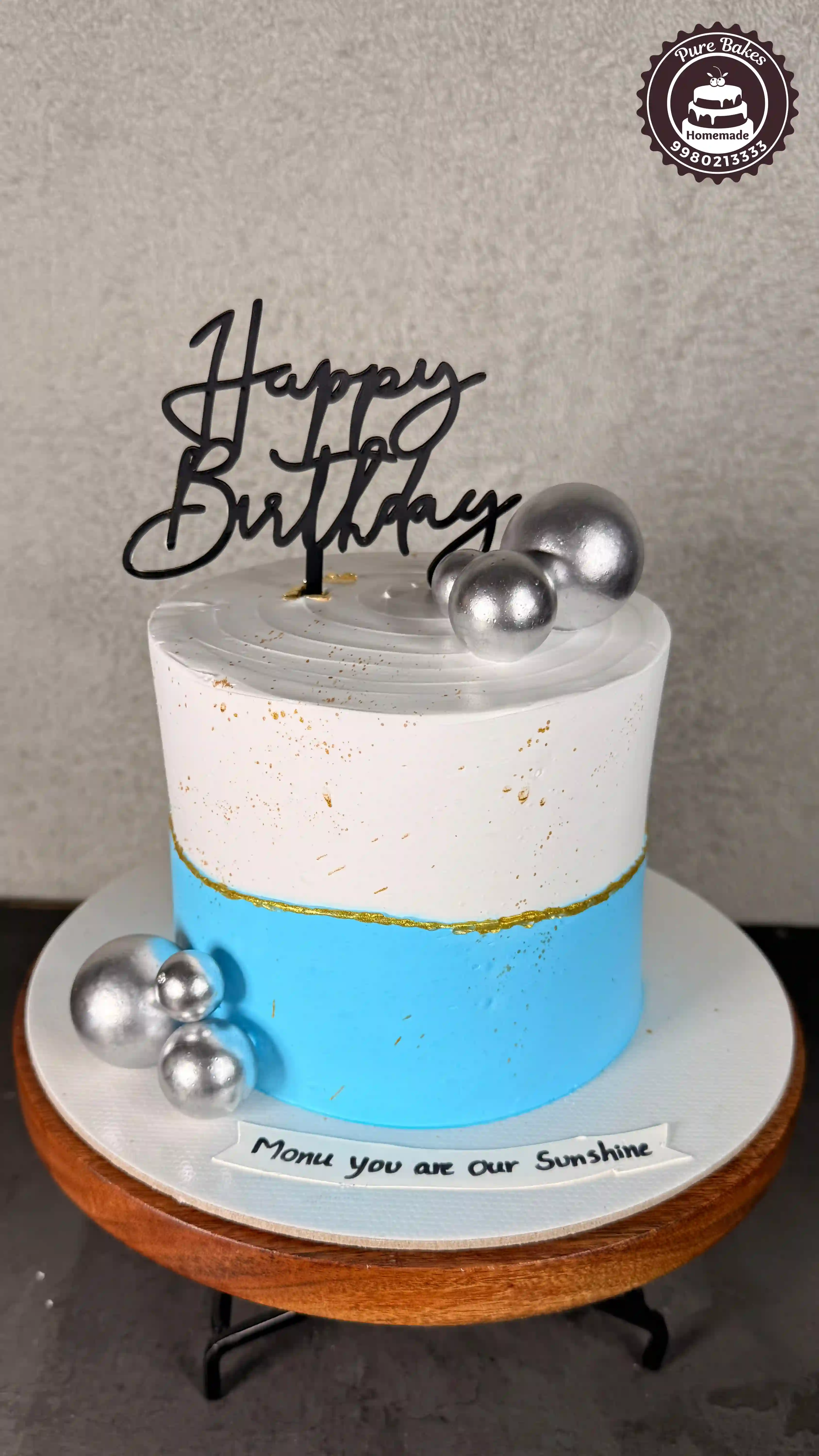 Blue and White Birthday Cake with Silver Balls Decor