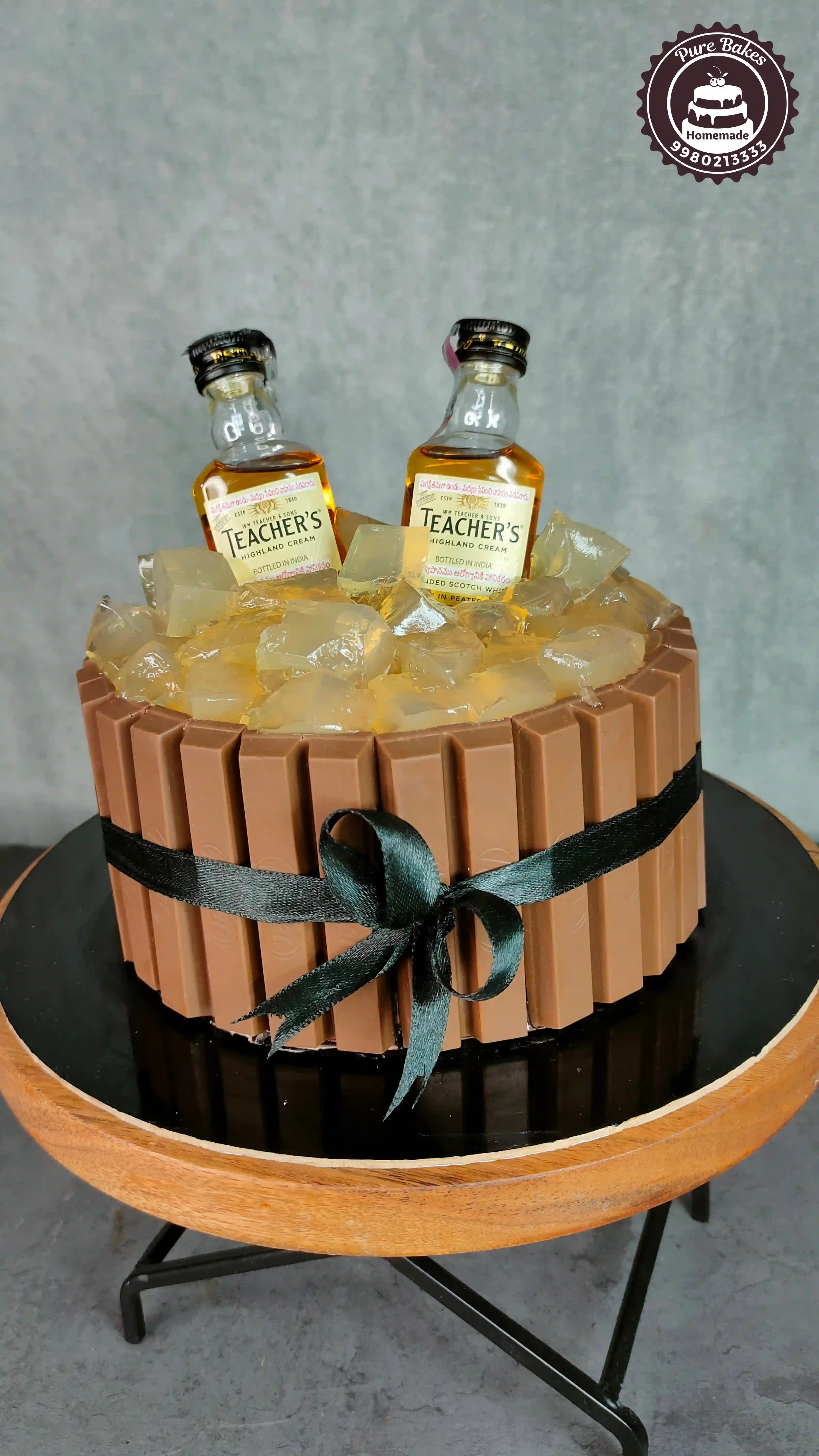 Chocolate KitKat Cake with Whiskey Bottles and Ice Topping