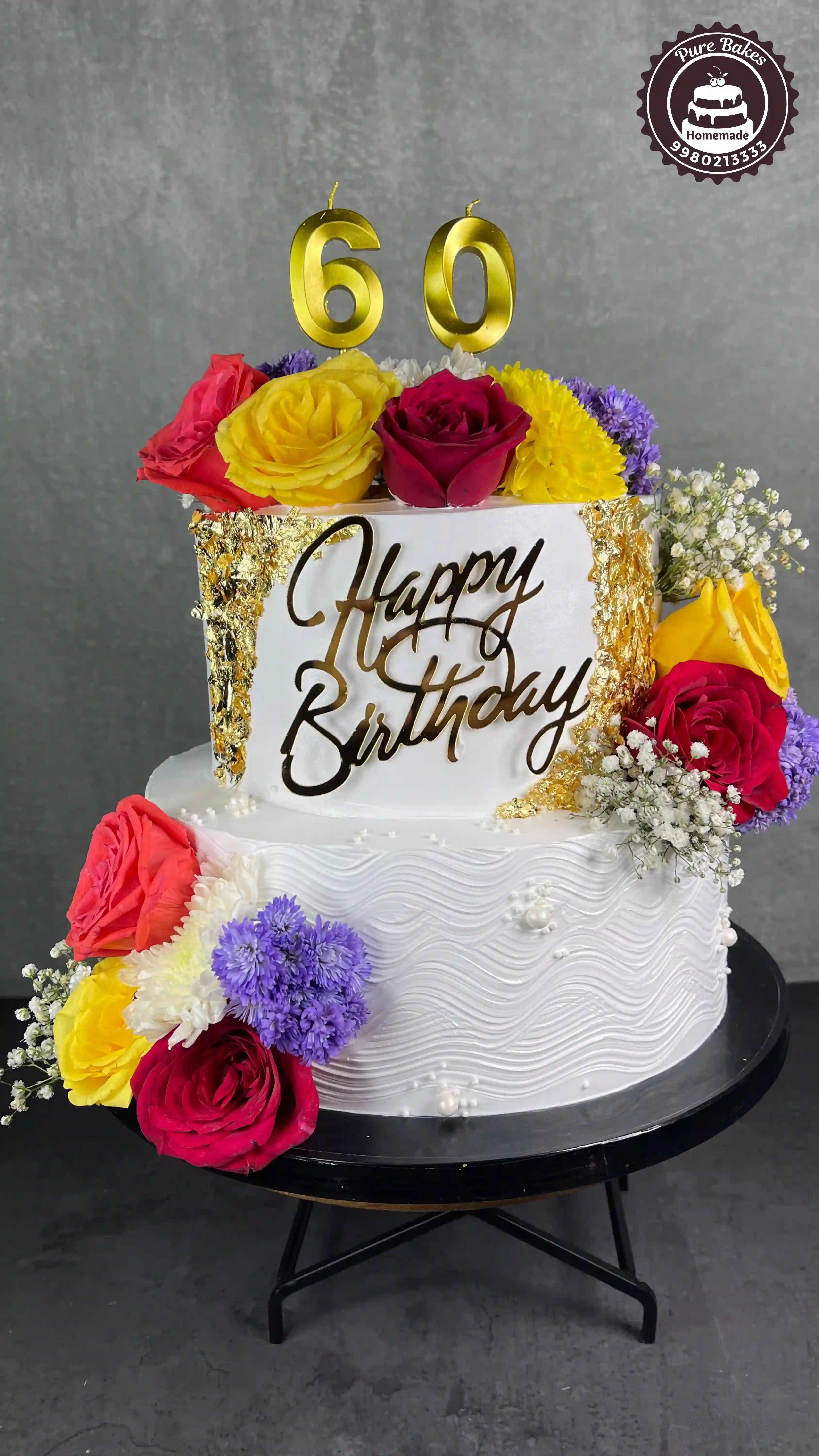 Colorful 60th Birthday Cake with Fresh Roses and Gold