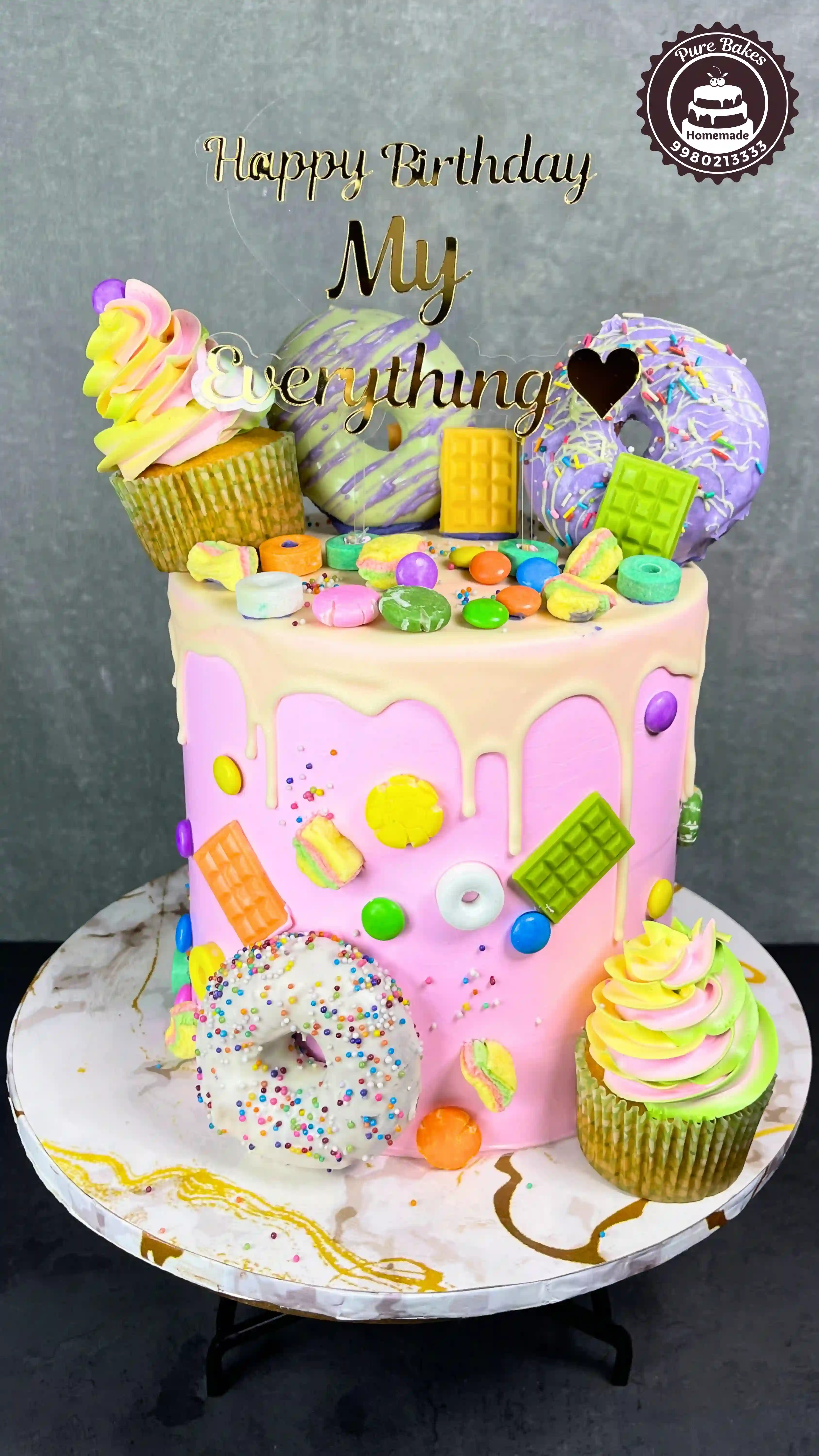 Colorful Candy Drip Birthday Cake with Donuts and Cupcakes