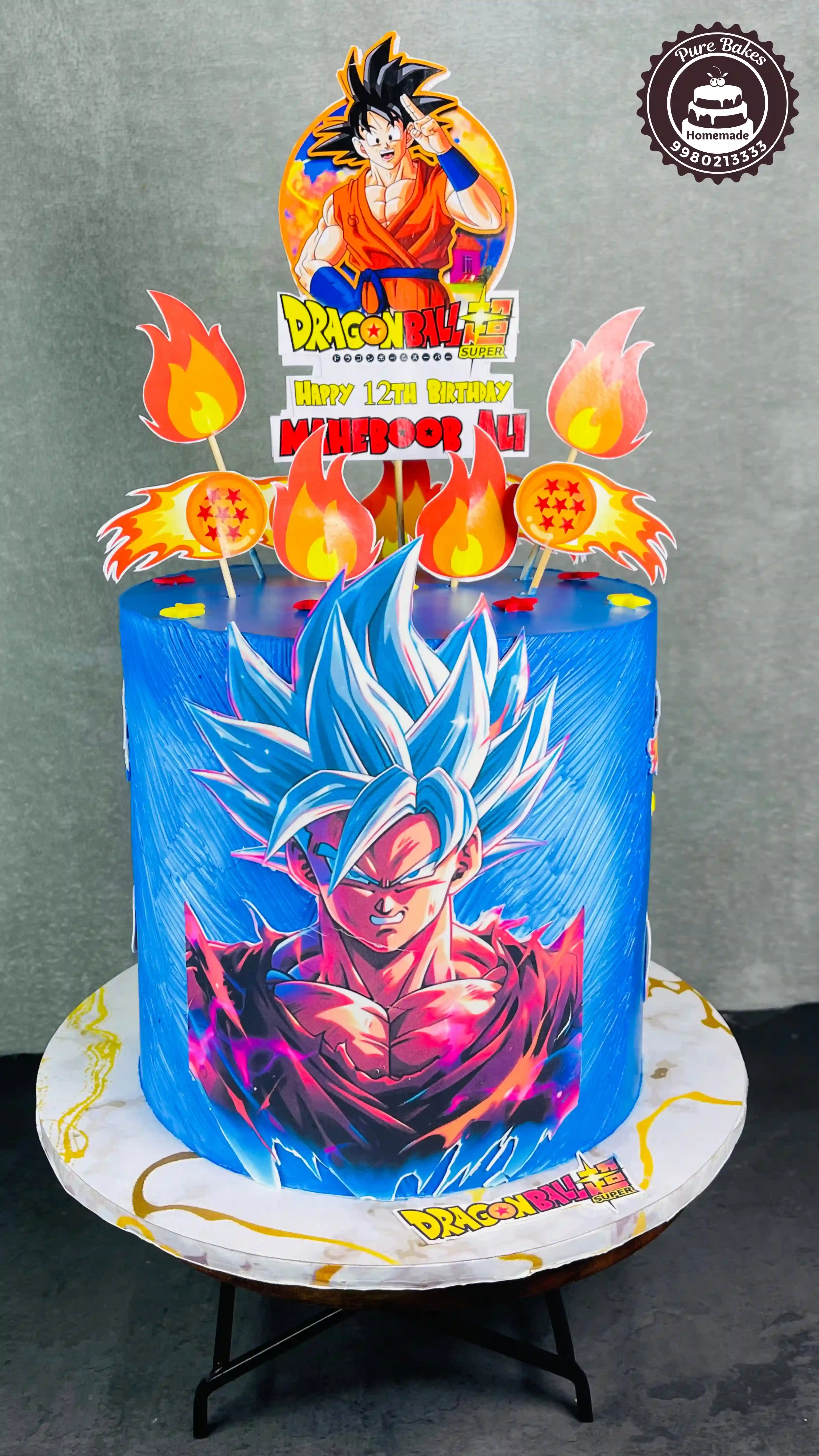 Dragon Ball Super Themed Blue Birthday Cake With Fiery Anime Topper