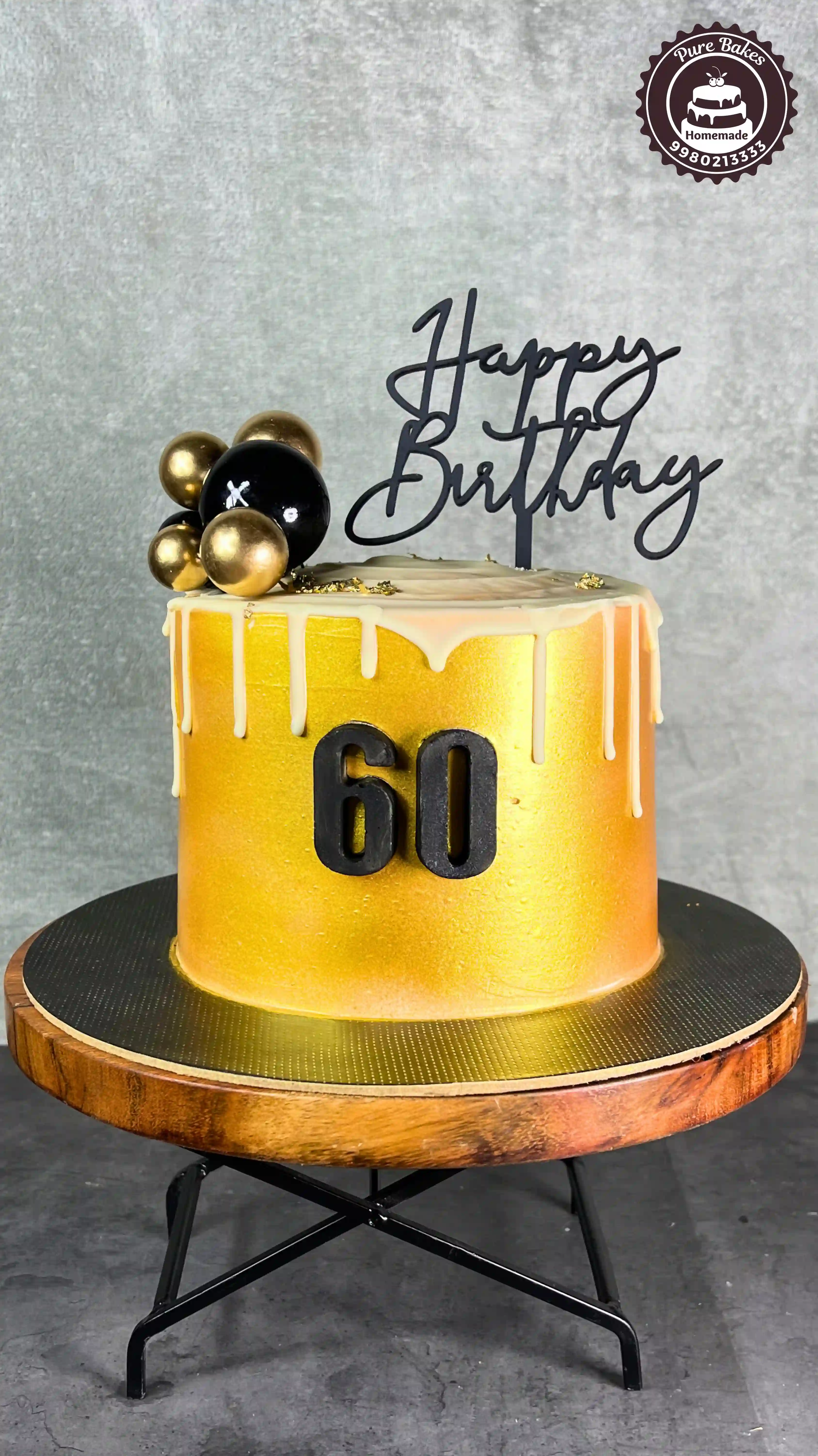 Golden Drip Birthday Cake with Stylish Sixty Number Design