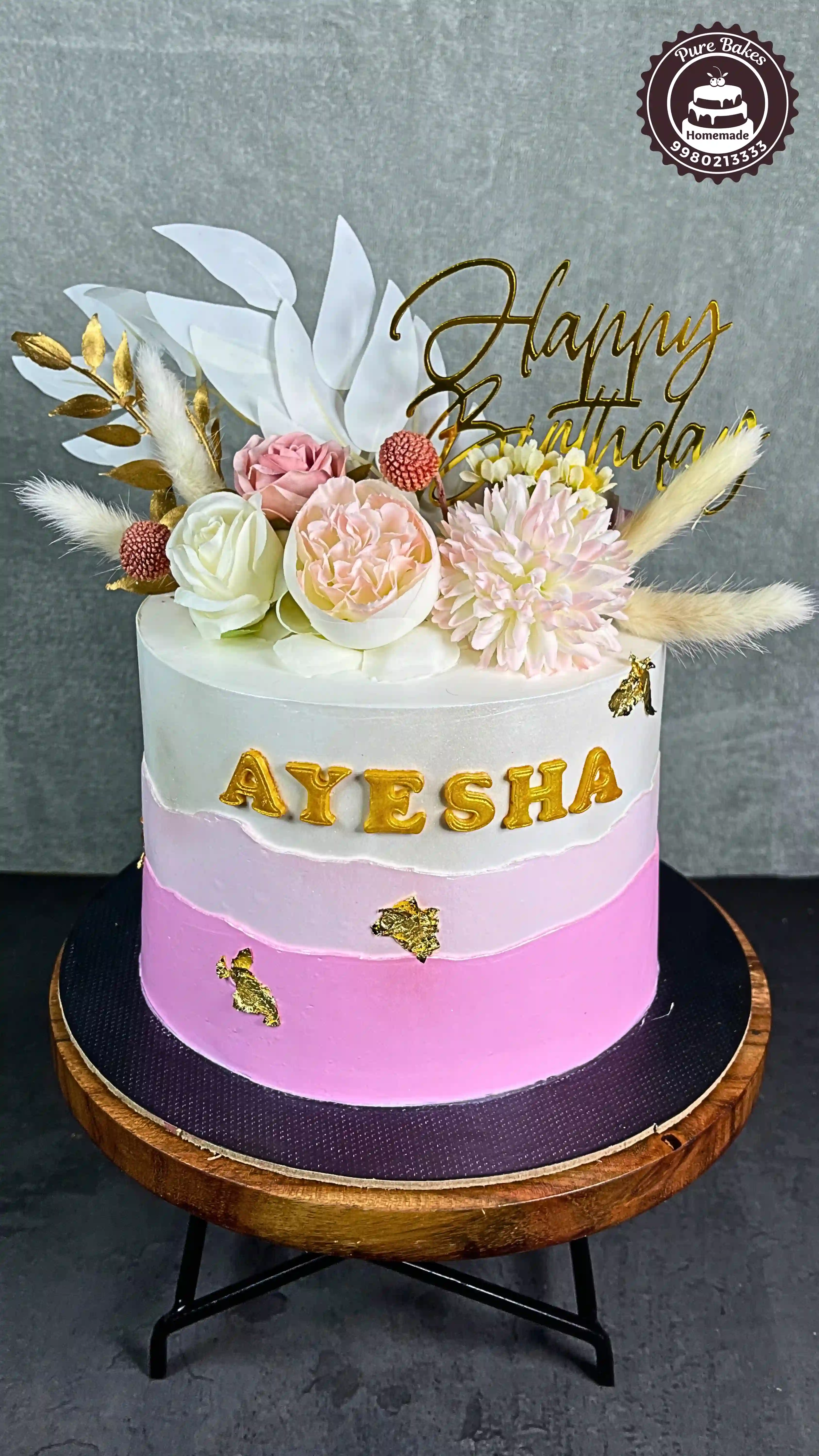 Pink Birthday Cake with Gold Accents and Fresh Blooms