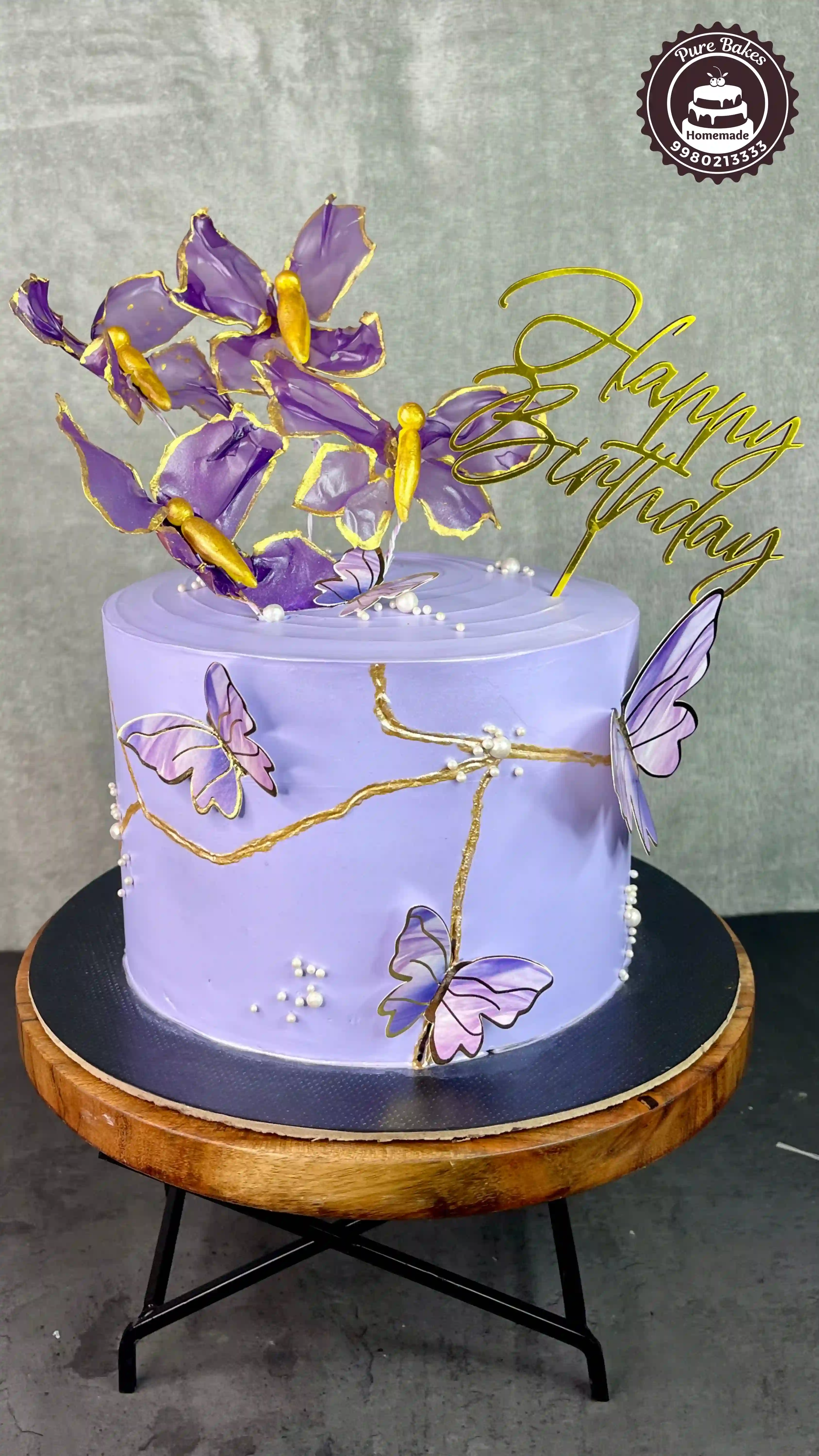Purple Butterfly Birthday Cake with Artistic Sugar Decorations