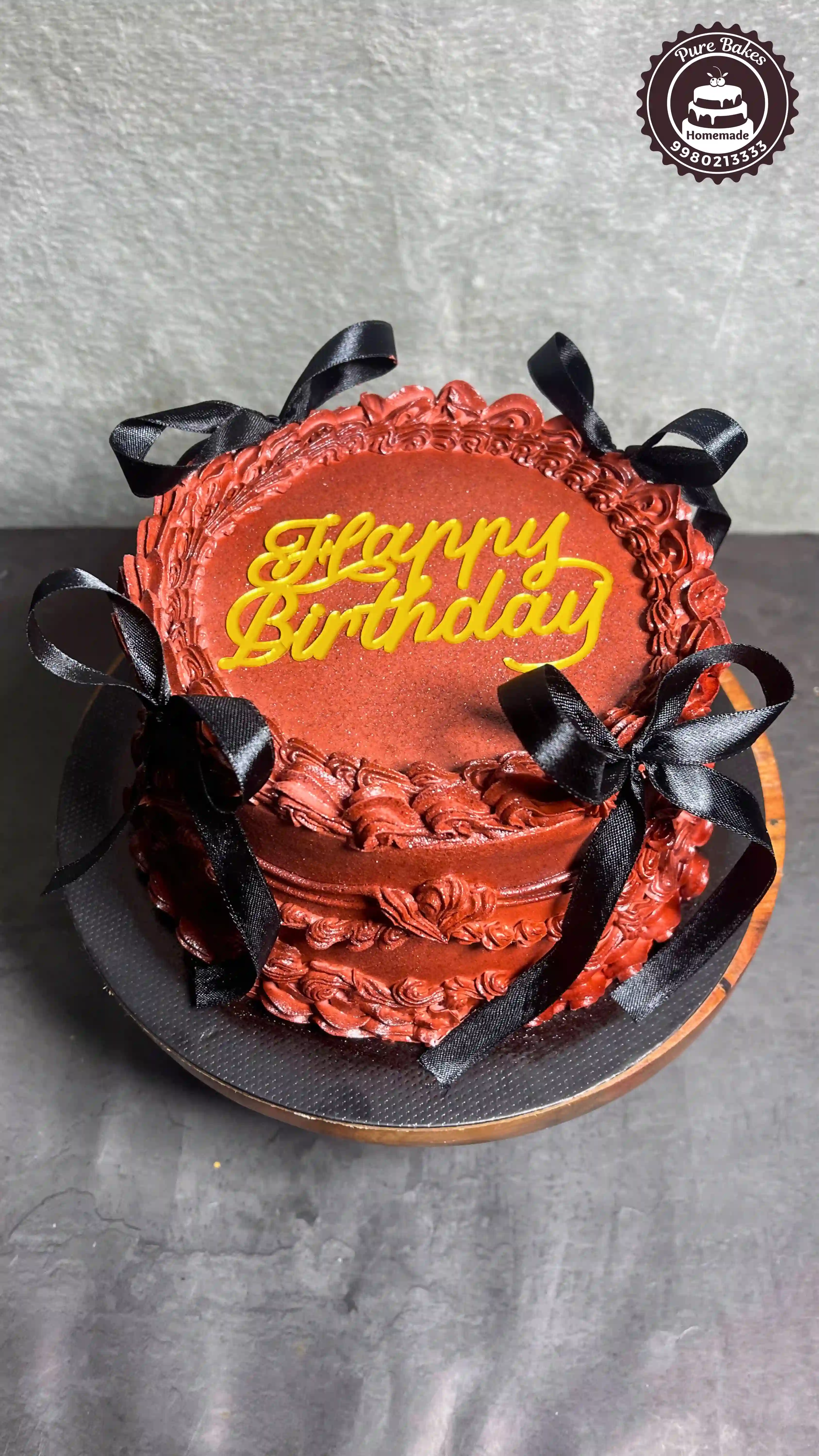 Rich Chocolate Birthday Cake With Black Ribbon Bow Design