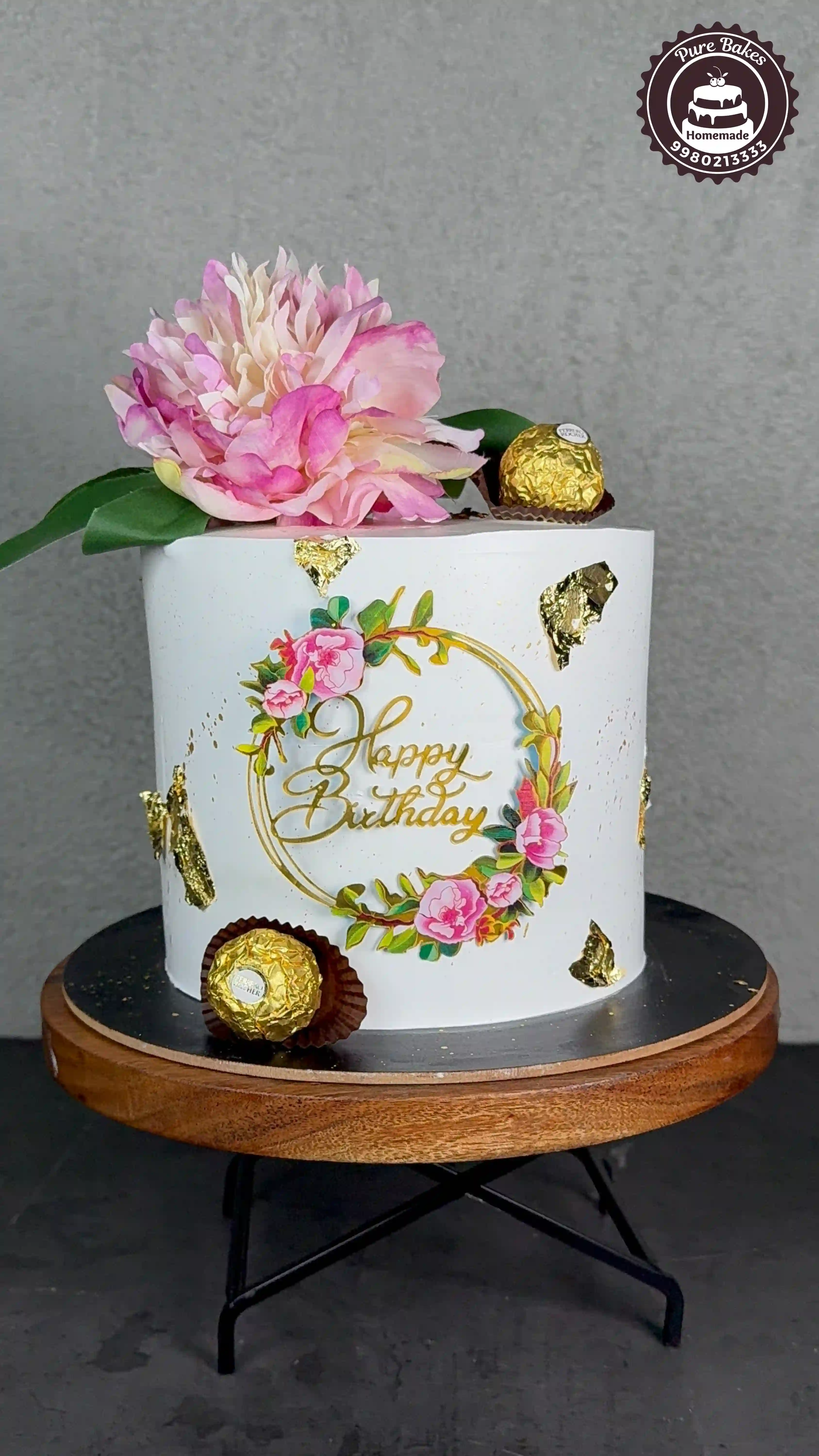 White Birthday Cake with Gold Accents and Peony Decor