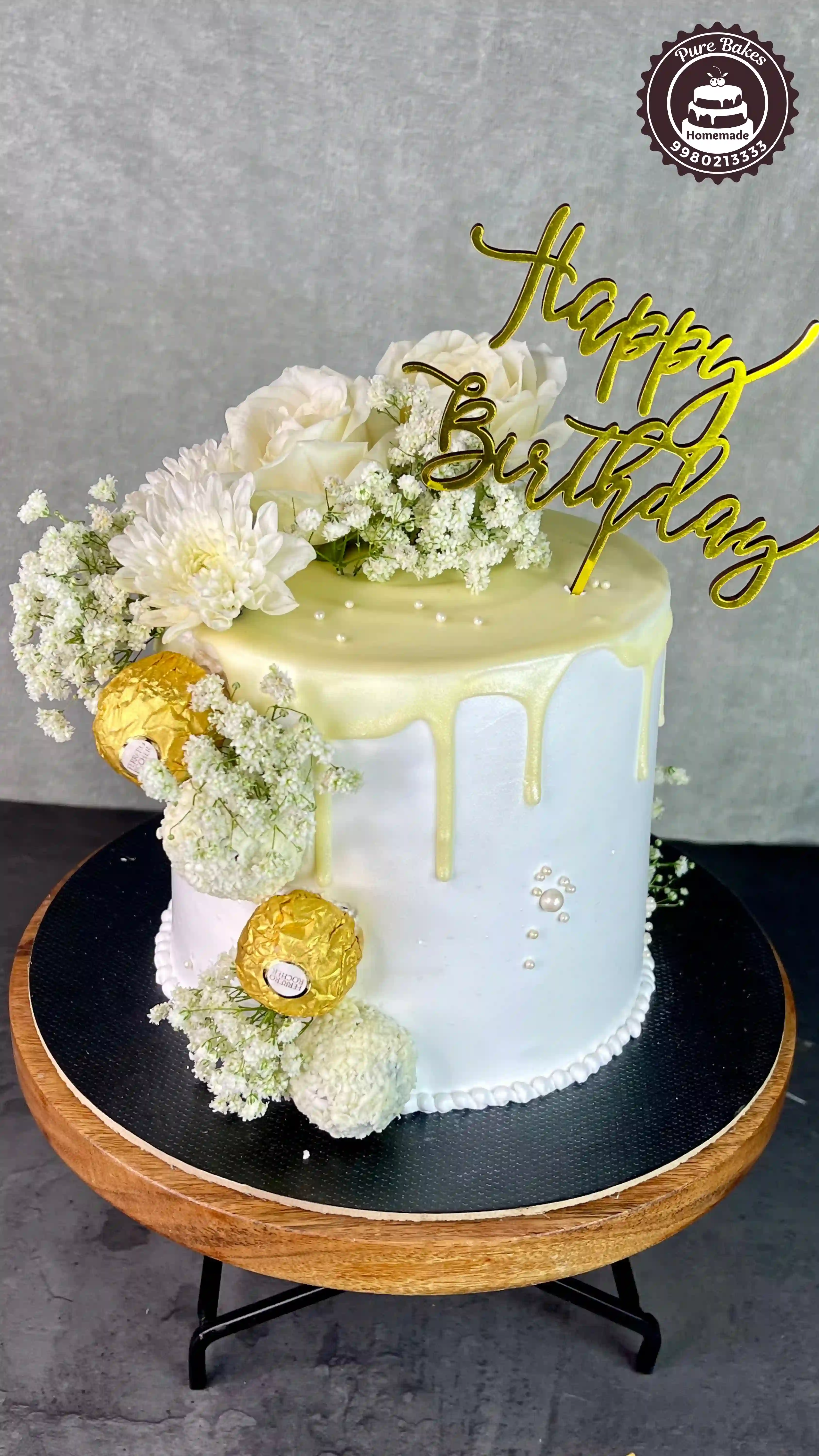 White Drip Birthday Cake with Fresh Flowers and Chocolates