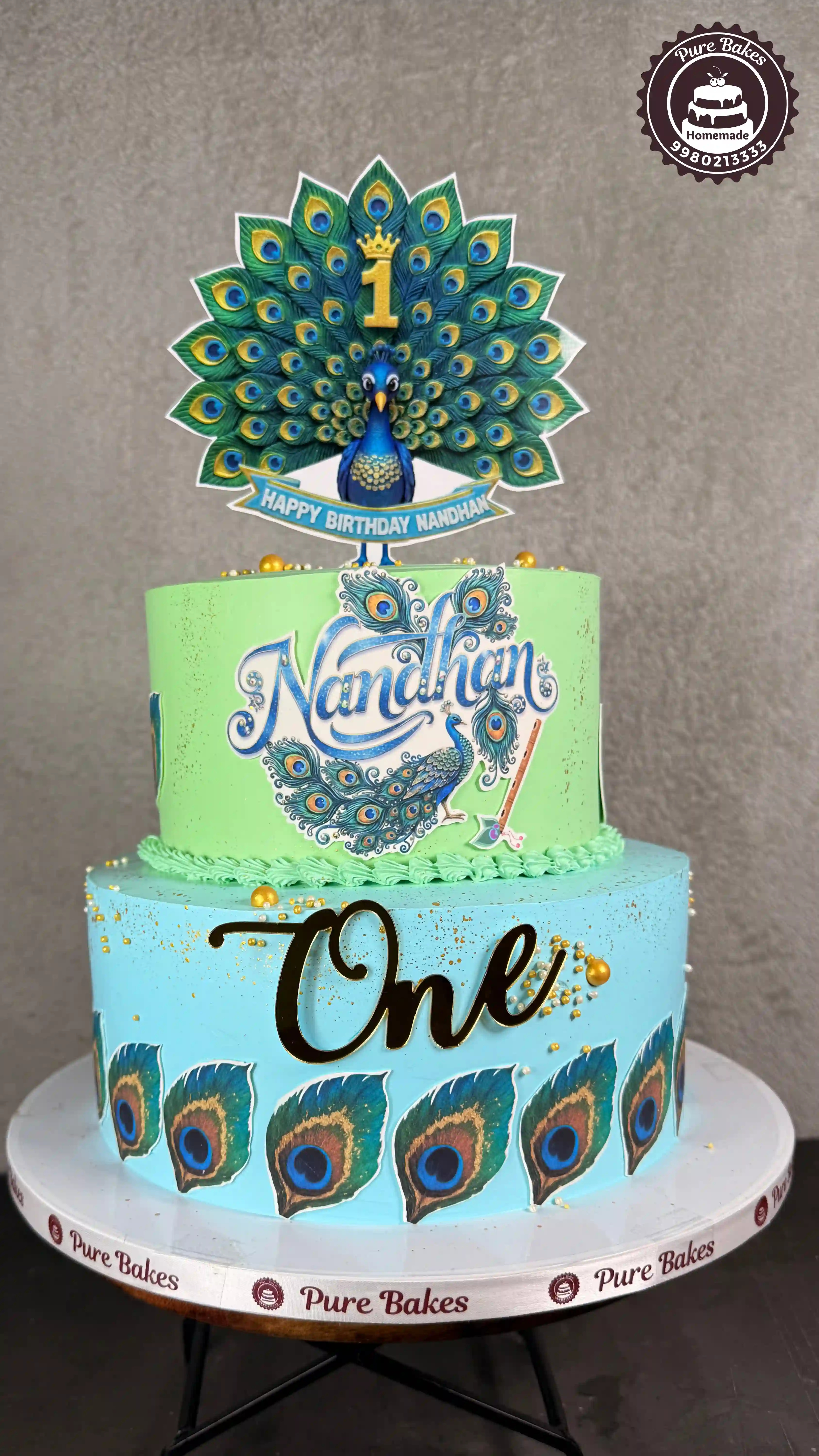 Peacock Theme First Birthday Cake with Custom Name Topper